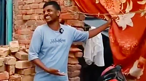 Md Irfan in front of his home