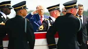 Donald Trump and his secretary of war Pete Hegseth (far right) putting a brave face on setbacks