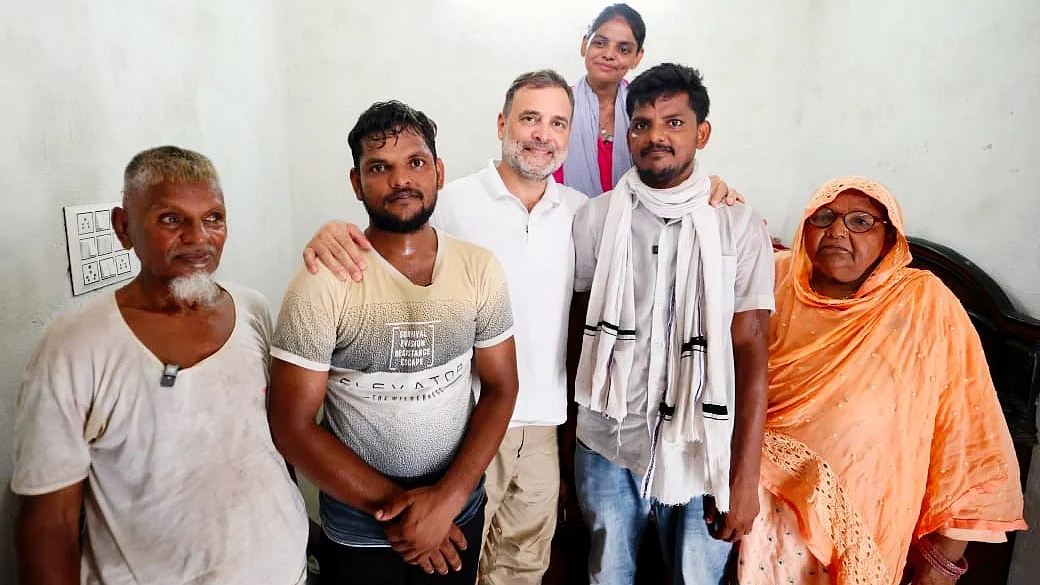Rahul Gandhi with Md Irfan (R) and his family