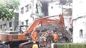 Rescue teams search for survivors after Bhiwandi building collapse.