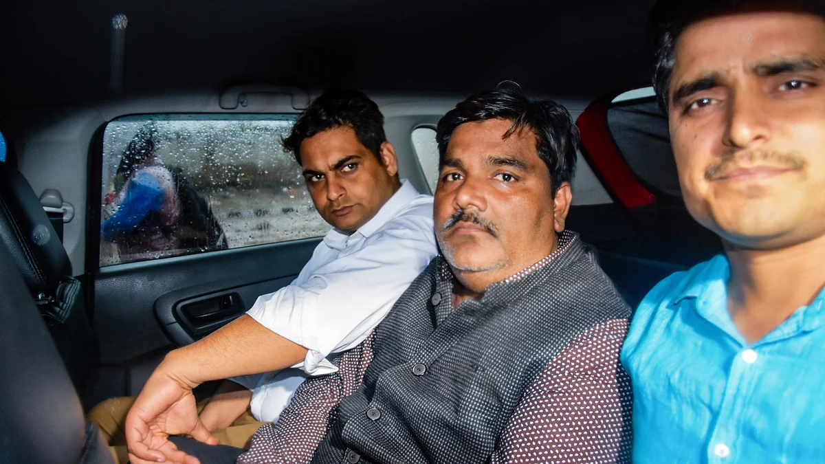 File photo from 6 March 2020 showing Tahir Hussain leaving Sunlight police station, New Delhi