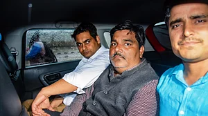 File photo from 6 March 2020 showing Tahir Hussain leaving Sunlight police station, New Delhi