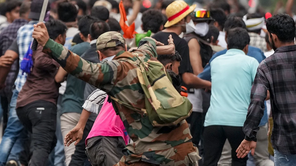 A policeman on a lathi charge
