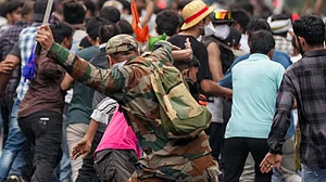 A policeman on a lathi charge