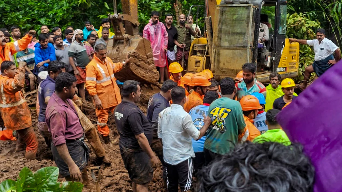 Rescue personnel during a rescue op following a landslide due to rain triggered floods in Kottayam.