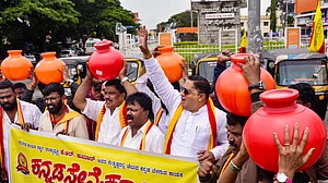 Kannada activists protest the directive to release Cauvery water to Tamil Nadu, in Bengaluru, 1 August