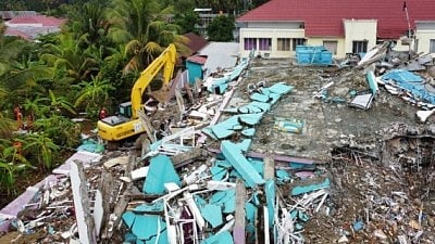 The undersea quake damaged buildings and triggered landslides