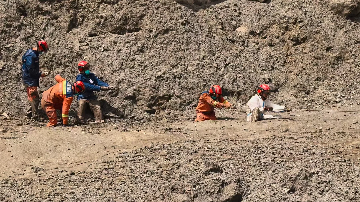 Rescuers conduct search operations at mudslide-hit Gyirong Port in southwest China’s Xizang region.