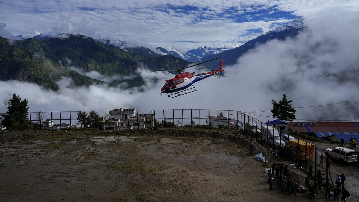 Security personnel conduct search and rescue operations following devastating flash floods in Rasuwa.