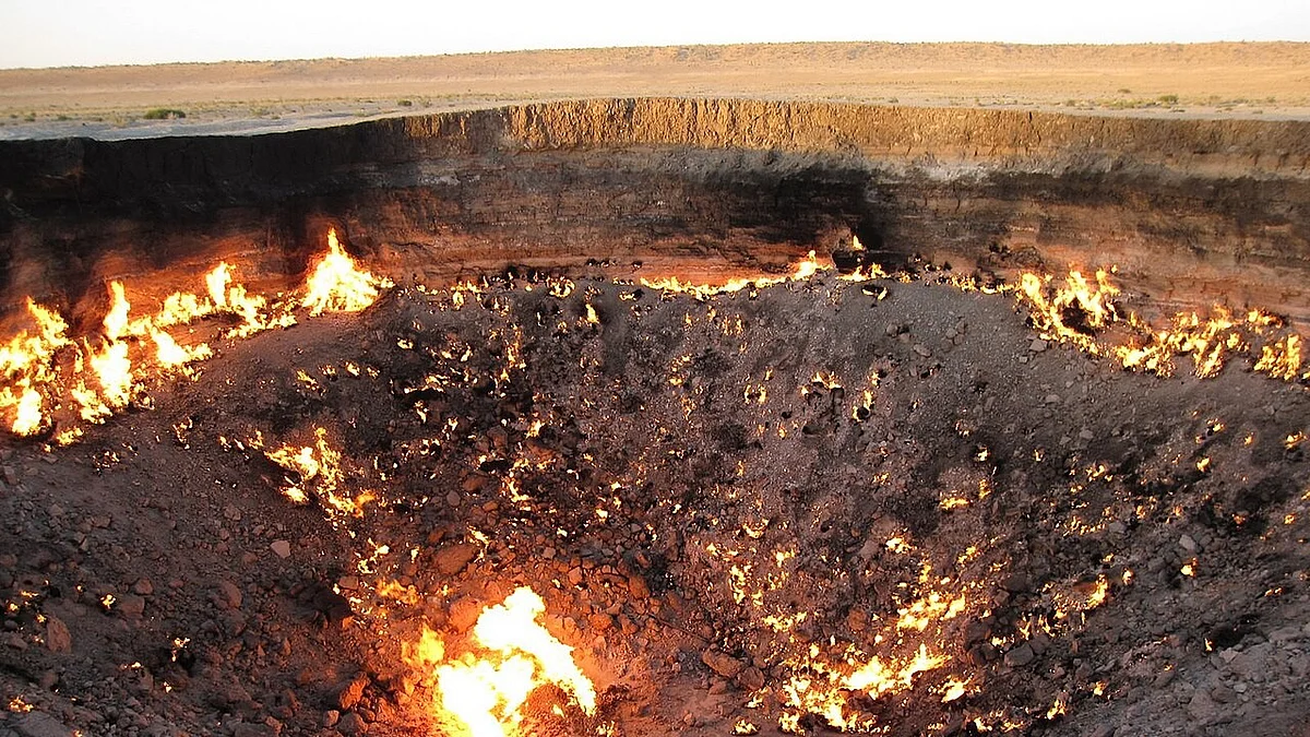 Turkmenistan's Darvaza crater, also called Door to Hell is a burning gas field collapsed into a cavern.