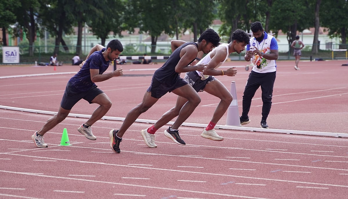 Coach Suresh Kumar does the data-crunching with athletes in action