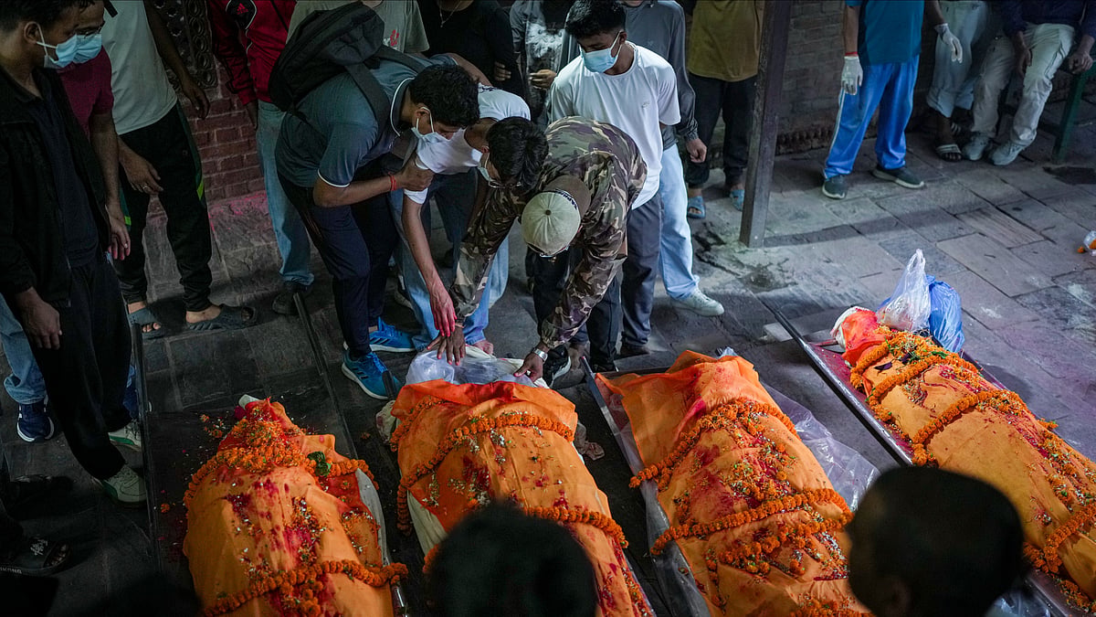 Families perform final rites for flood victims in Kathmandu.