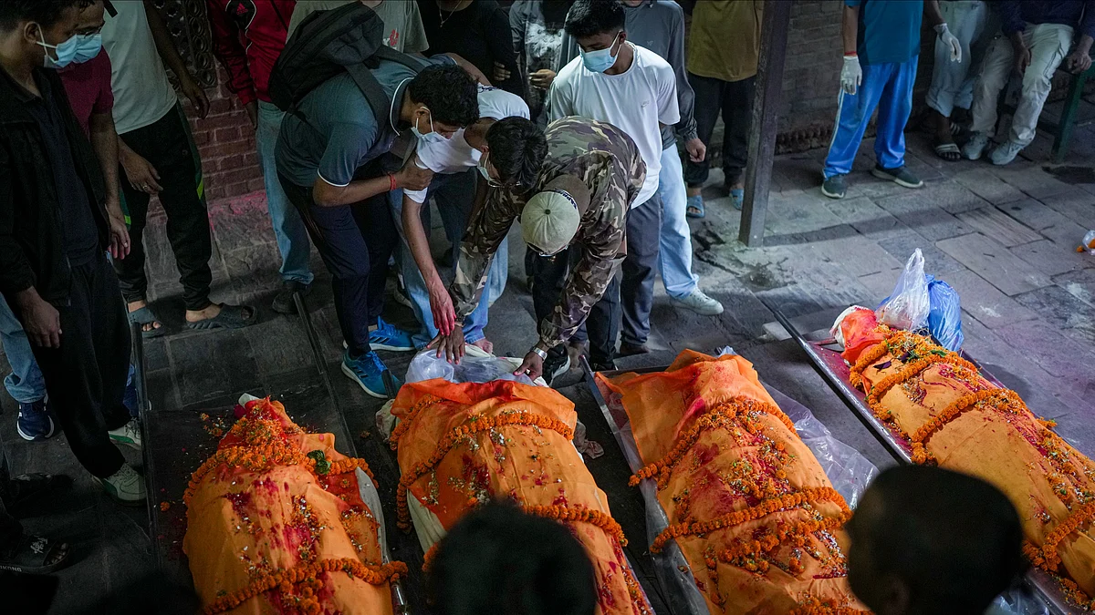 Families perform final rites for flood victims in Kathmandu.