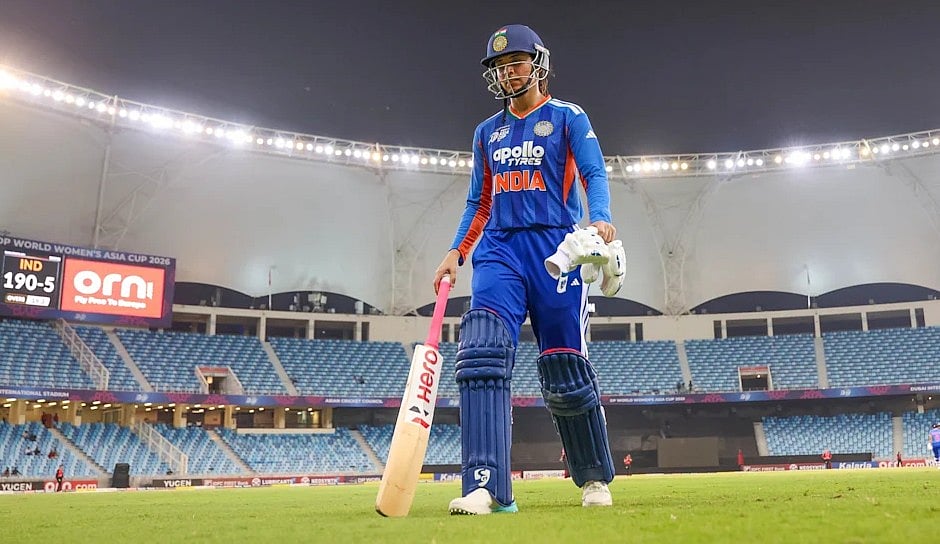 Smriti Mandhana walks back after he century on Thursday