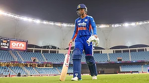 Smriti Mandhana walks back after he century on Thursday