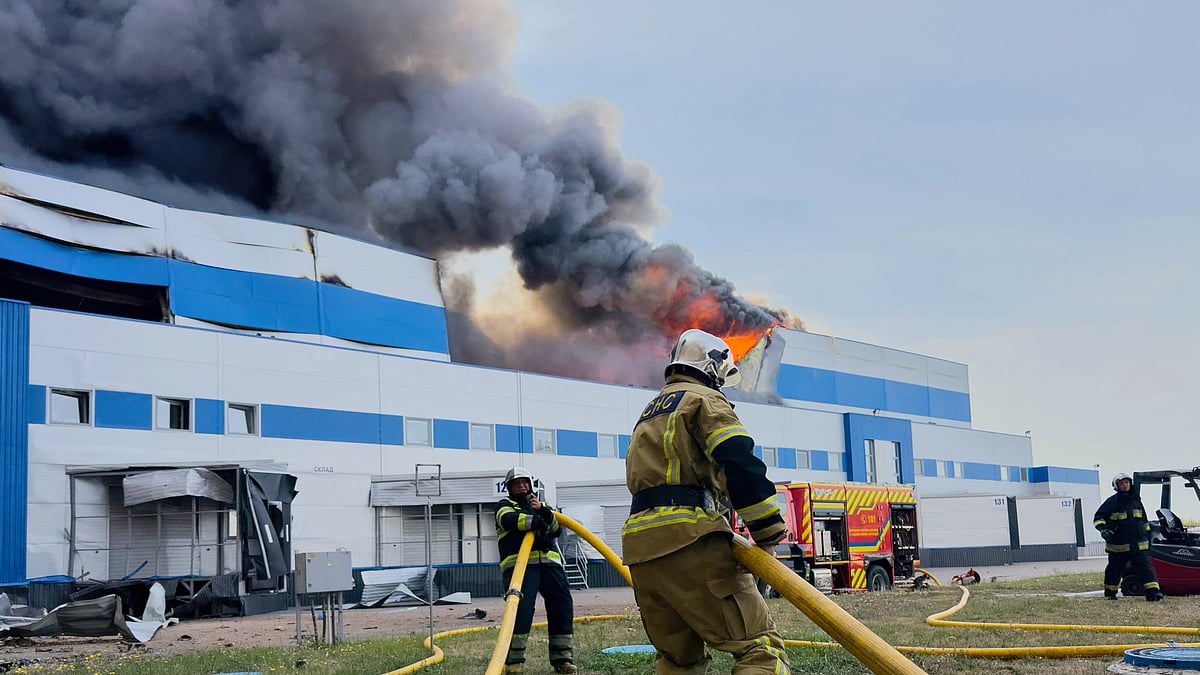 Emergency personnel extinguish a fire at a pharmaceuticals warehouse after a Russian strike near Kyiv, 3 Sept