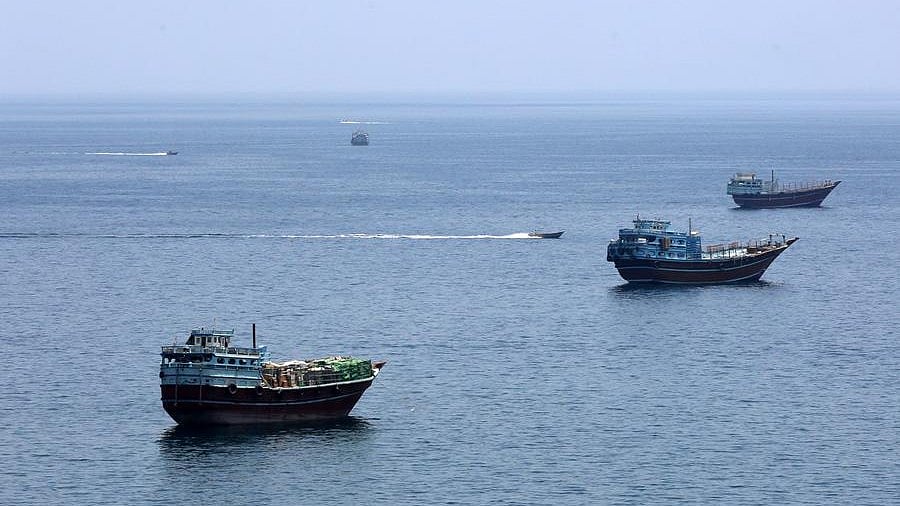 Vessels sail through the Strait of Hormuz amid rising tensions.