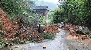 Road blocked by mud and stones after heavy rain in Hunan, China.