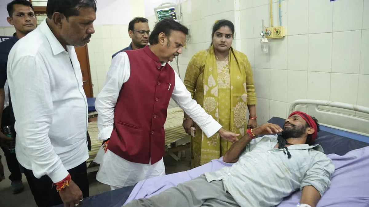 Deputy chief minister and Sagar district in-charge minister Rajendra Shukla meets a patient.