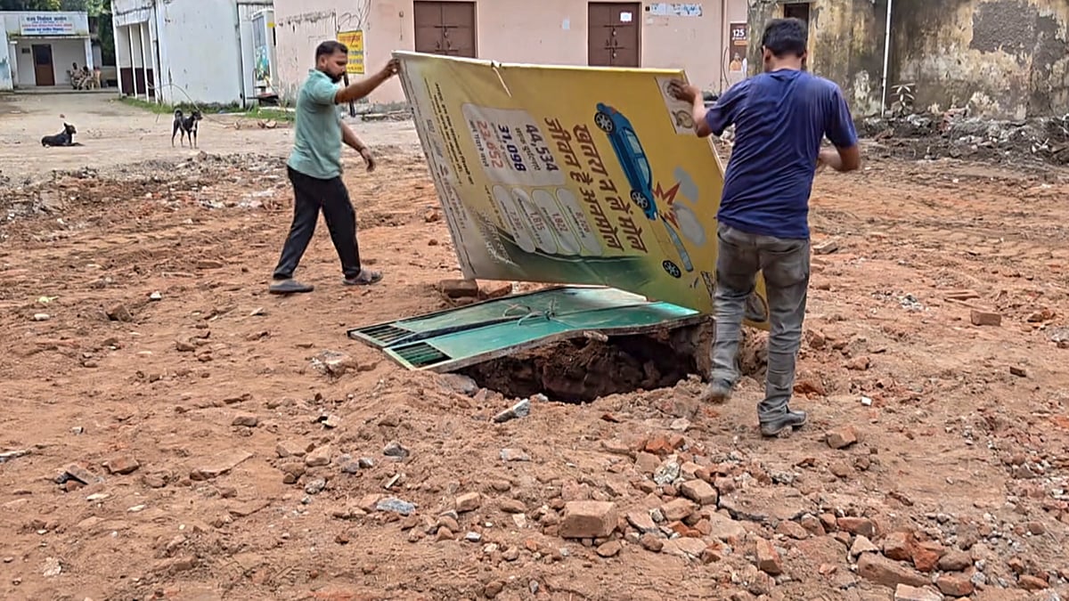 Workers uncover a well beneath the debris of the demolished mosque, in Saharanpur, 6 Sep