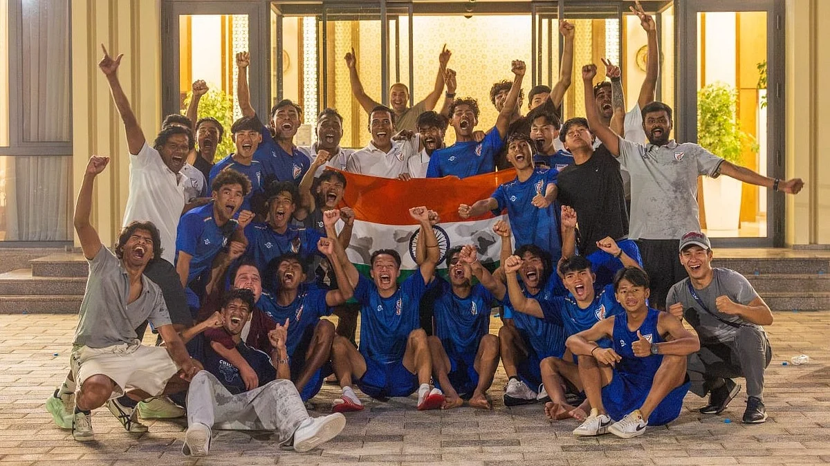 Mahesh Gawali (in white) celebrates with his boys in Tashkent.