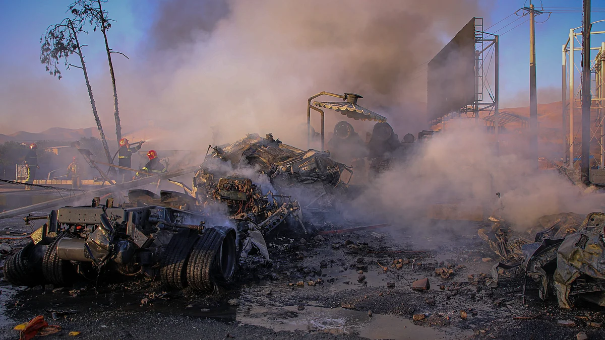 Firefighters at scene after tanker crash near Sanandaj, Iran on 5 September.