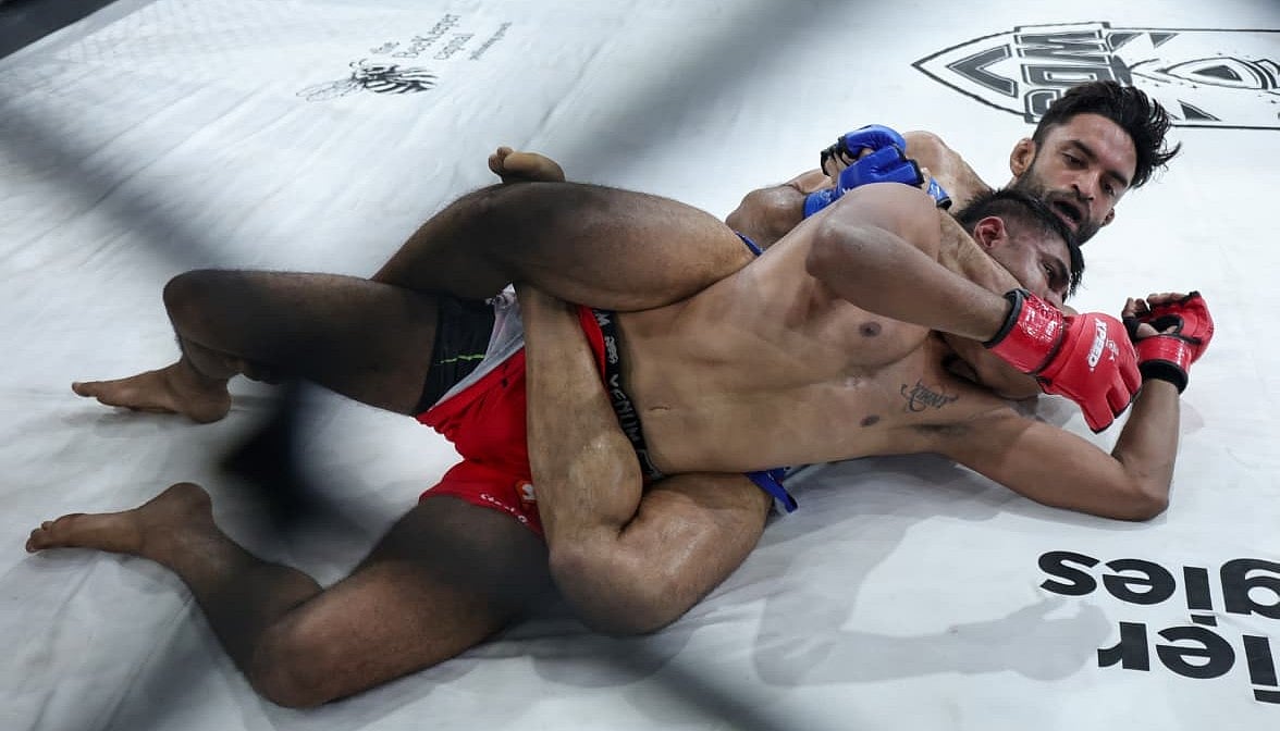 Varun Sanyal (blue) in the thick of action
