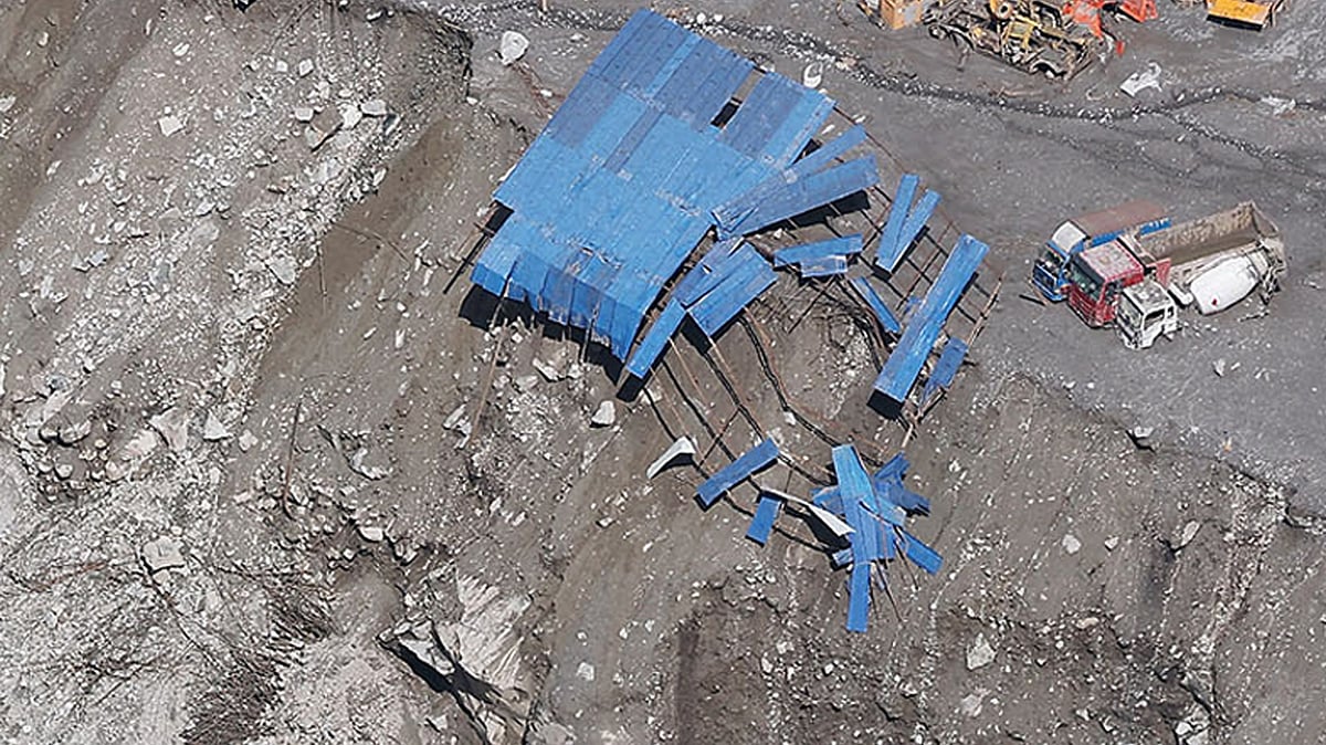 A hydroelectric power plant construction site covered with debris in Rasuwa district.