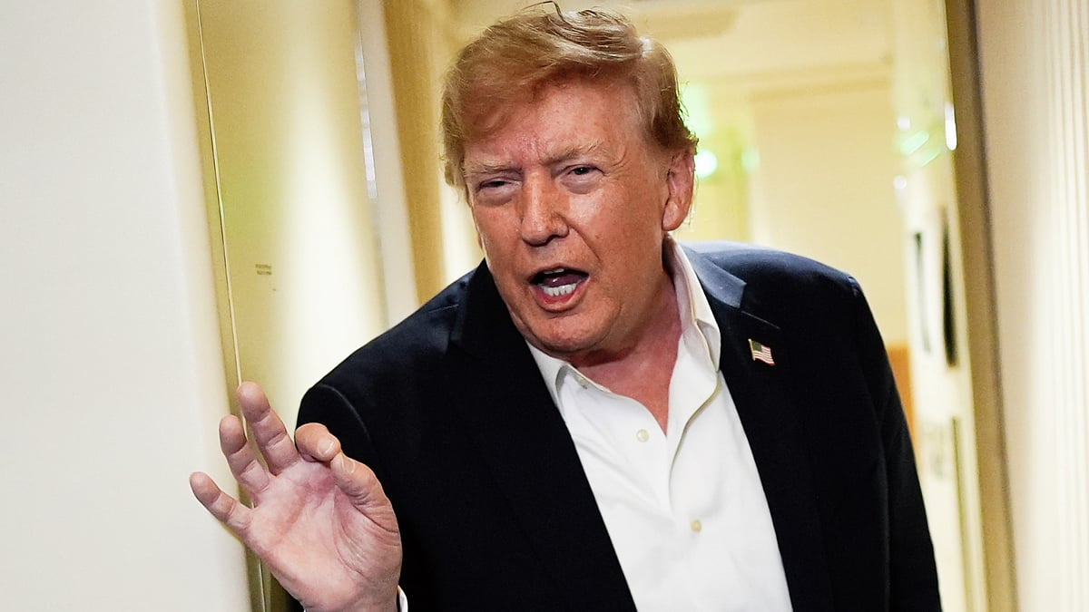 Donald Trump speaks to reporters aboard Air Force One, 13 Sep
