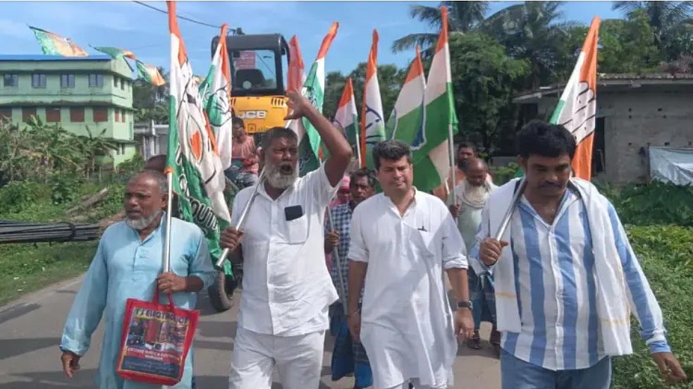Congress observer Ranajit Mukherjee (C) campaigns in Nandigram