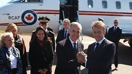 Macron says France and Canada will strengthen cooperation in fisheries, security and energy.