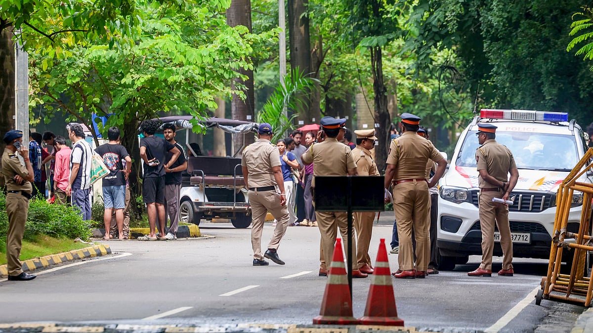 Police personnel stand guard as students protest in the Powai campus, 19 Sep