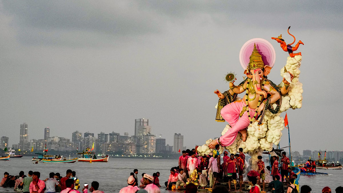 An idol of lord Ganesh is brought for immersion in Mumbai, 25 Sep