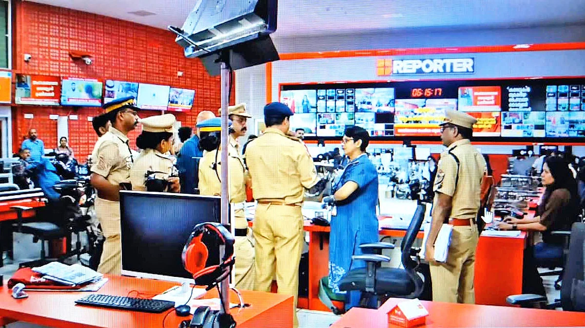 Police at the office of Reporter TV