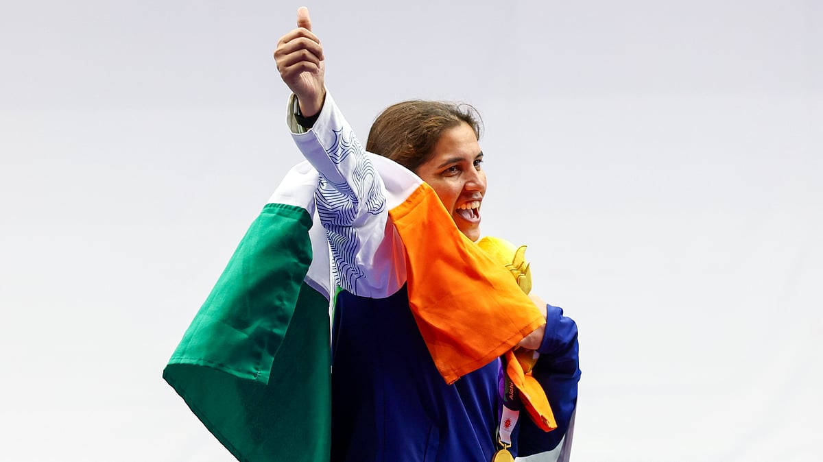 Neeru Dhanda celebrates during the medal ceremony in Aichi, Japan.