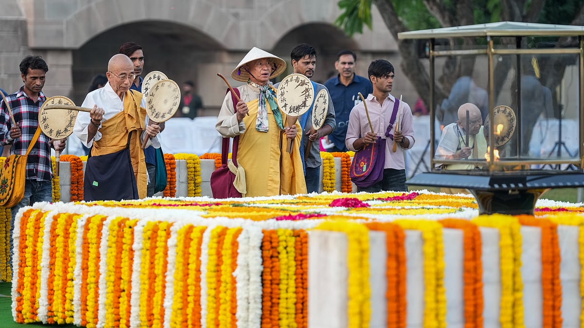 Monks and others play traditional Japanese ‘Uchiwa Daiko’ drums at Raj Ghat on Gandhi Jayanti.