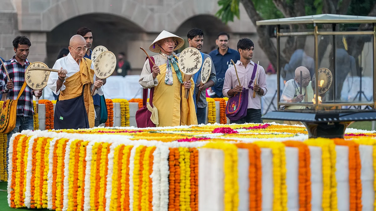Monks and others play traditional Japanese ‘Uchiwa Daiko’ drums at Raj Ghat on Gandhi Jayanti.