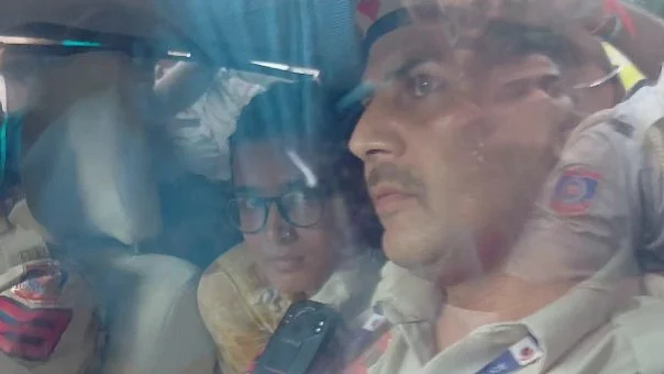 Bora was taken away in a car occupied by male police.
