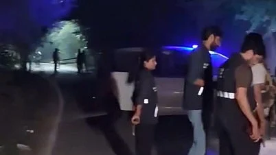 Two officers reportedly escape injury after bullets strike their protective jackets.