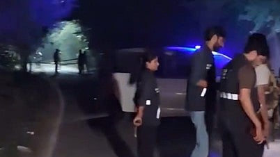 Two officers reportedly escape injury after bullets strike their protective jackets.