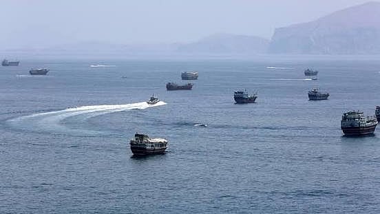 Vessels transit the Strait of Hormuz.