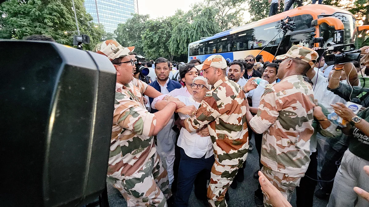 UP Congress in-charge Rajendra Pal Gautam being forcibly removed during an anti-SIR protest, 7 Oct