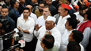 Mallikarjun Kharge (C), Rahul Gandhi and other INDIA bloc leaders before heading out to Rajghat