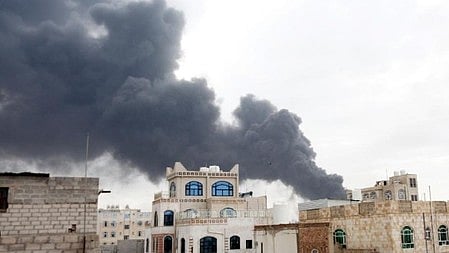 Smoke billows over Yemen following reported strikes.