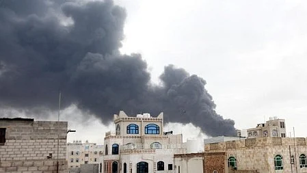 Smoke billows over Yemen following reported strikes.