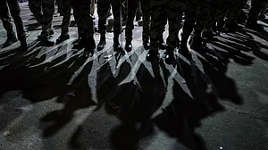Shadows of security personnel outside Akashvani Bhawan during the INDIA bloc protest march on 6 Oct