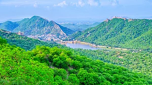 Lush greenery blankets Amber City and the Aravalli Range after rainfall.