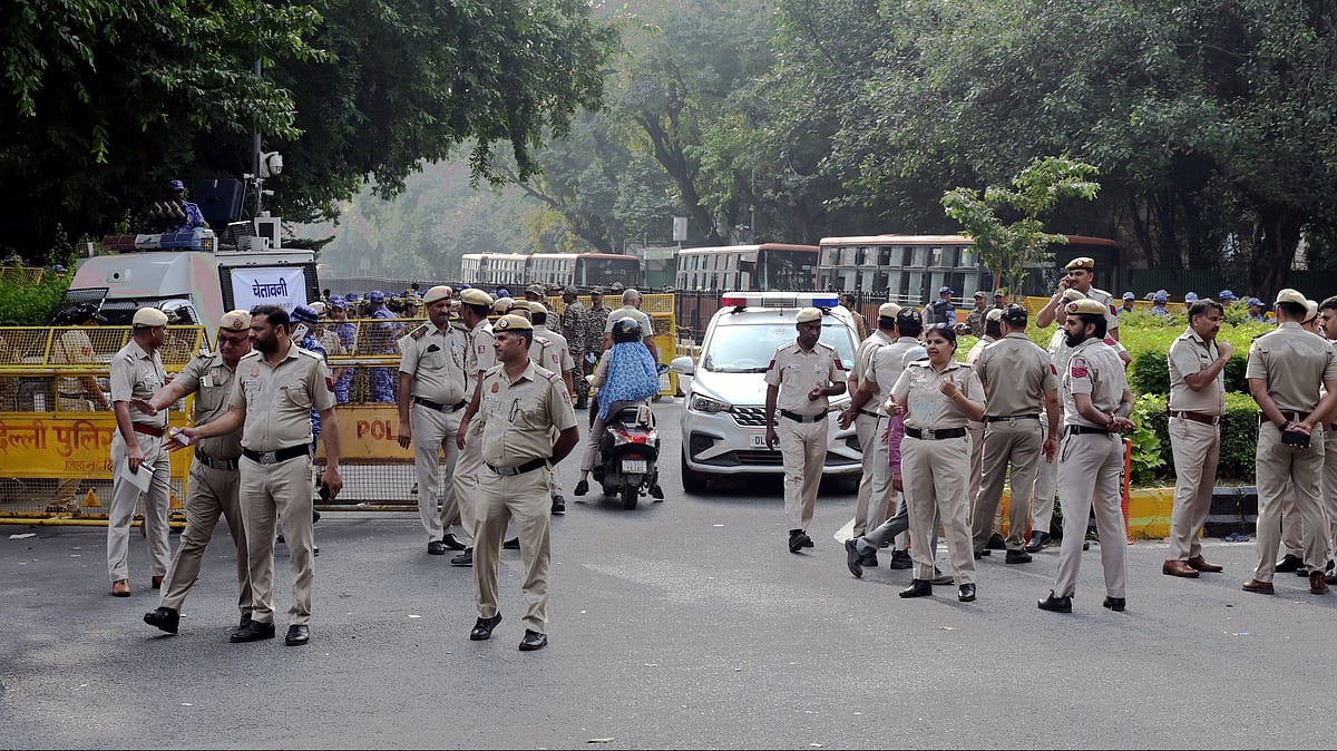 Security personnel stand guard on Ashoka Road amid CJP protests in New Delhi.
