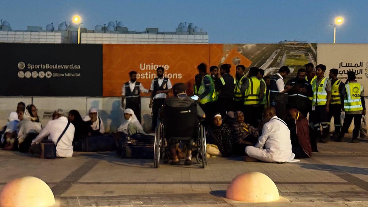 People outside a Metro station on the road to King Khalid International Airport in Riyadh, 10 Oct