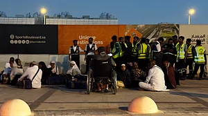 People outside a Metro station on the road to King Khalid International Airport in Riyadh, 10 Oct